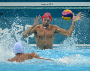 Italy's Stefano Tempesti (C) guards the